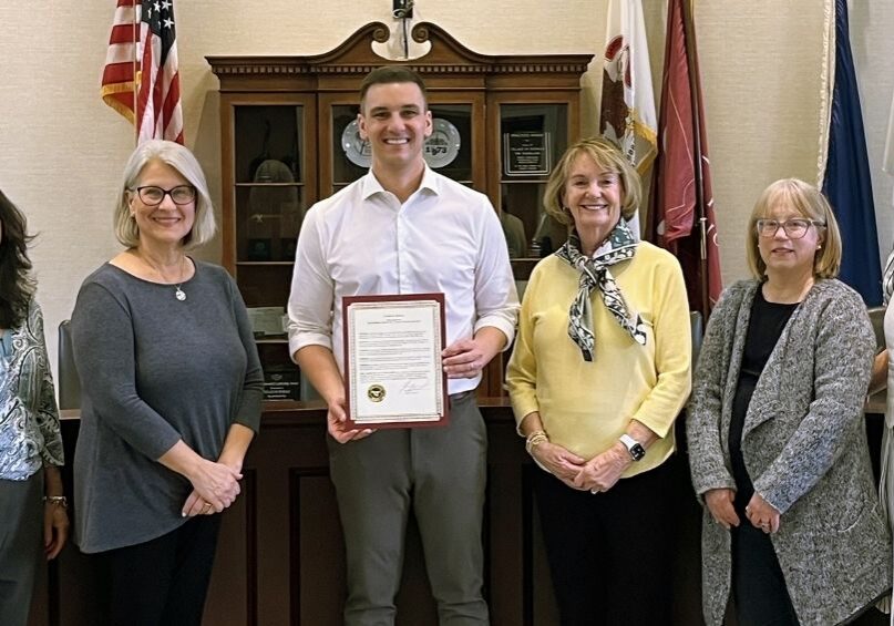 From left to right, Theresa Nevling, Lisa Everette, Village President Greg Hart, Maureen Hegarty, Beth Waldo and Kristina Goel pose with the proclamation for ALCW’s 30 years of service. 