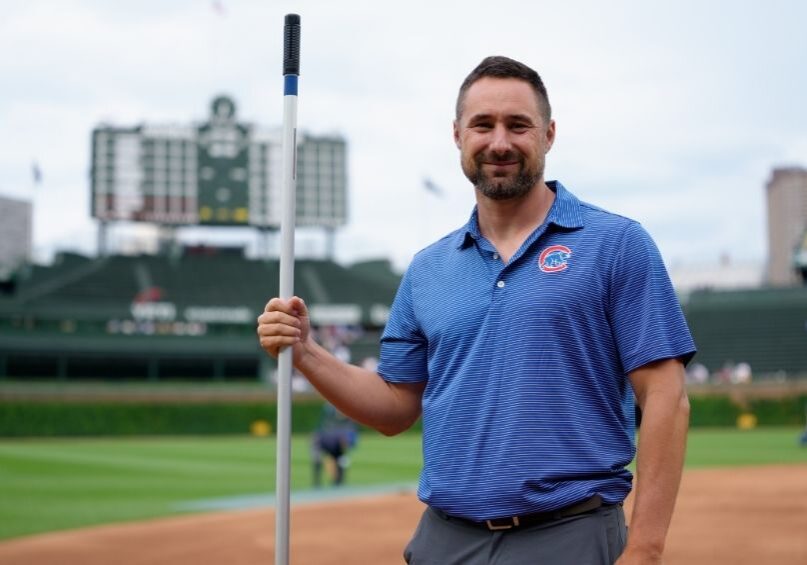 Dan Kiermaier prepares the field at historic Wrigley Field during the club’s 150th anniversary as a National League franchise.