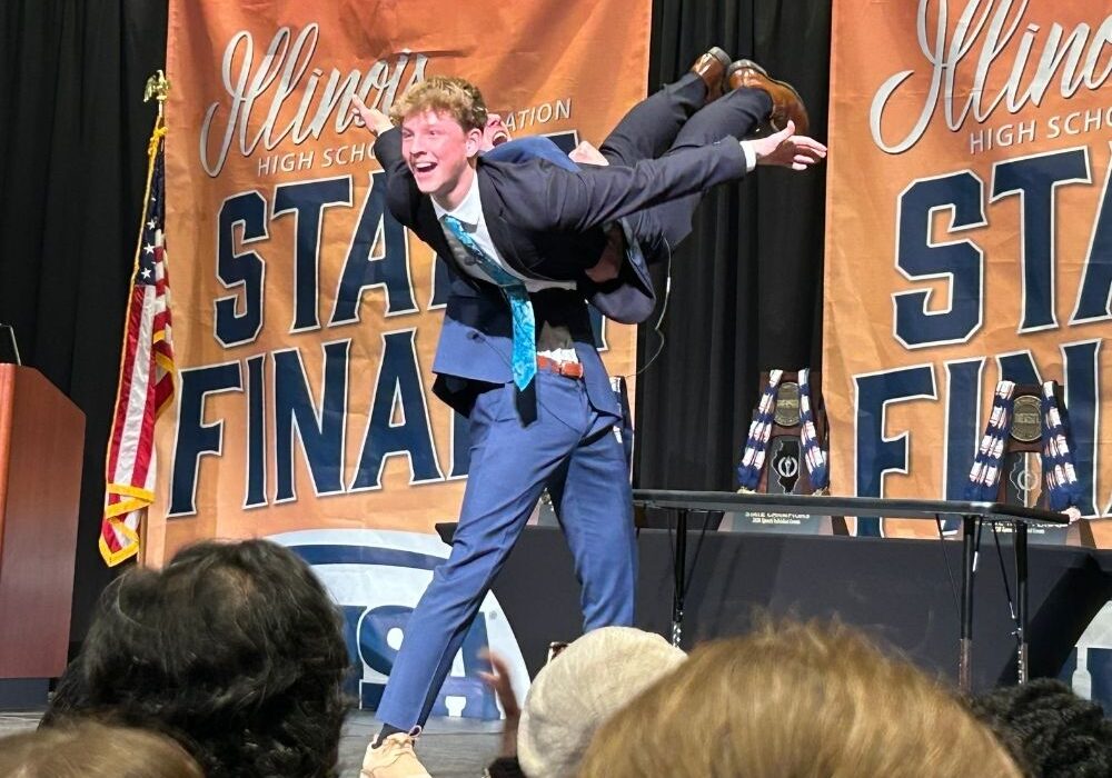 Albin Stromberg is lifted by Michael McGowan during a state performance. 
