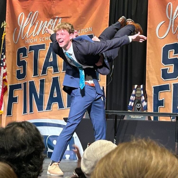 Albin Stromberg is lifted by Michael McGowan during a state performance. 